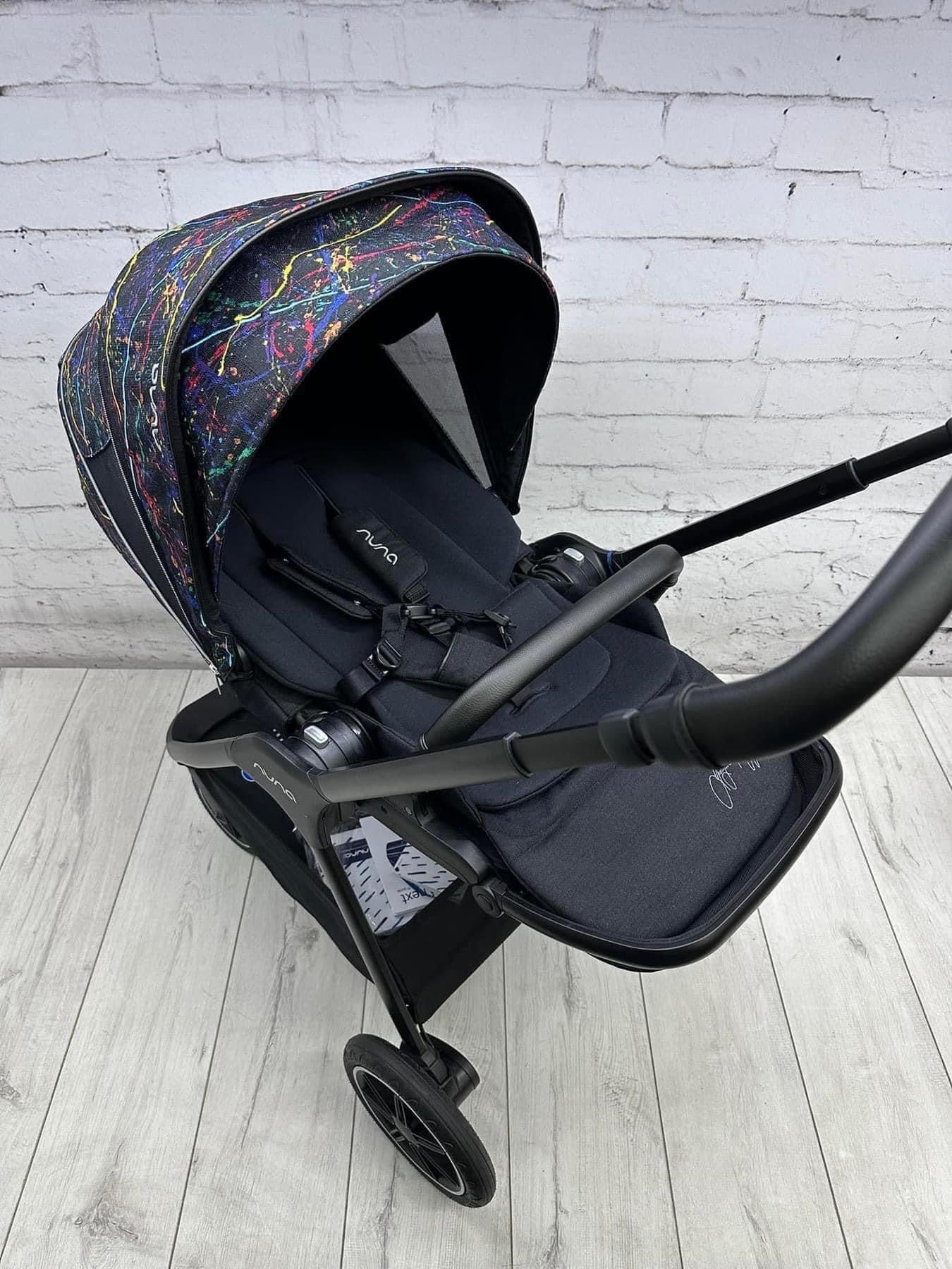 Nuna Triv Next and Cari Carrycot Rainbow Georgette Polizzi Todl and rotating base