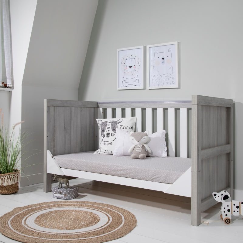 Grey and cheap white cot bed